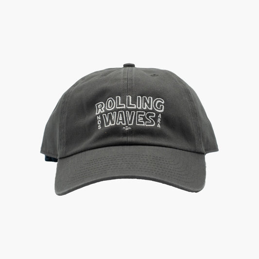Front view of Rolling Waves Everyday Cap in dark grey with off-white block logo, garment-washed cotton twill unstructured cap with adjustable fit