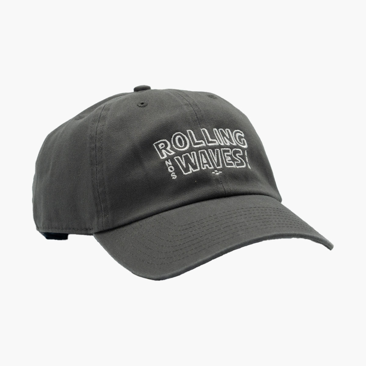 Side angle of Rolling Waves Everyday Cap in dark grey with off-white block logo, garment-washed cotton twill unstructured cap with adjustable fit