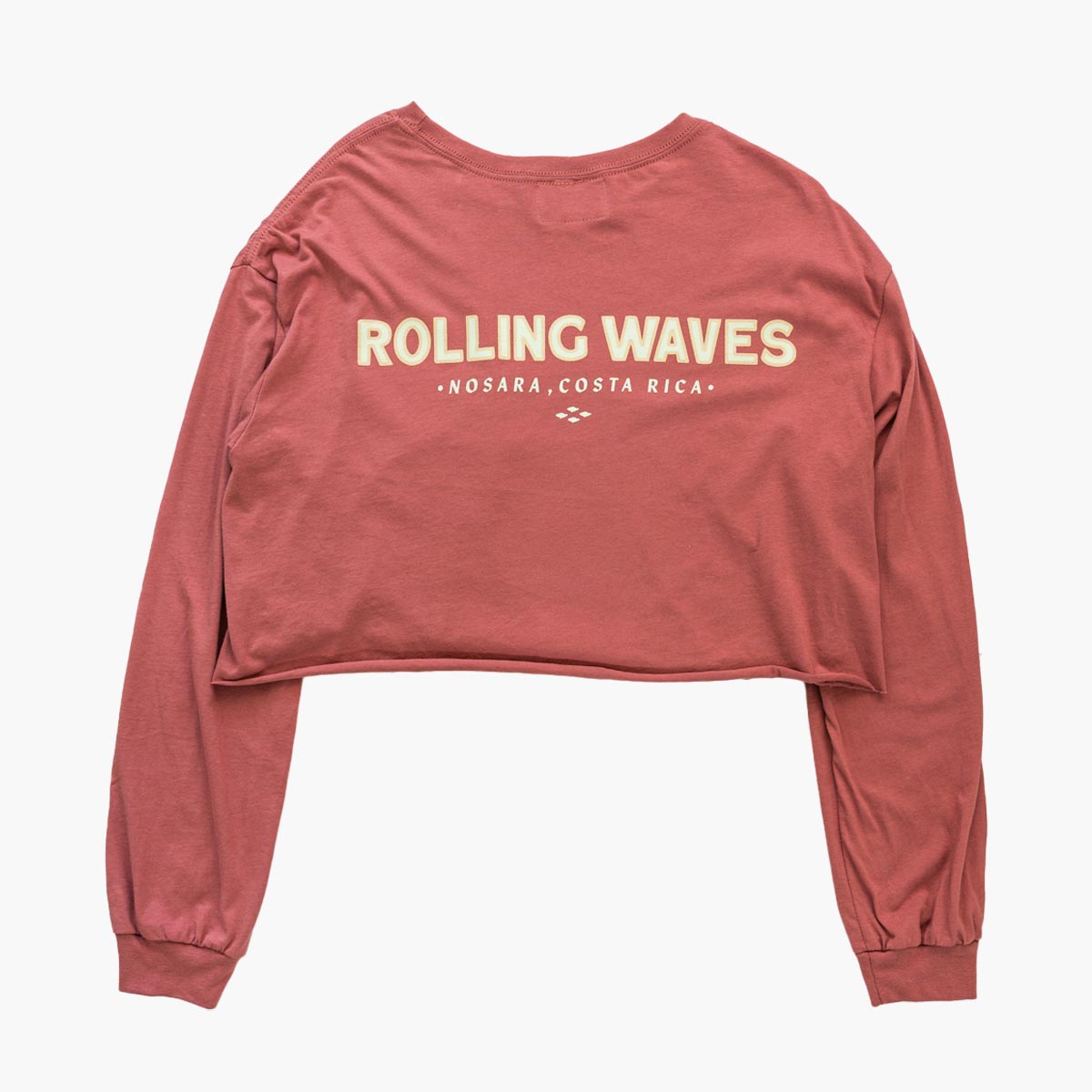 Back view of Flow Crop Long-Sleeve showing one-line cream logo on reddish pink cotton