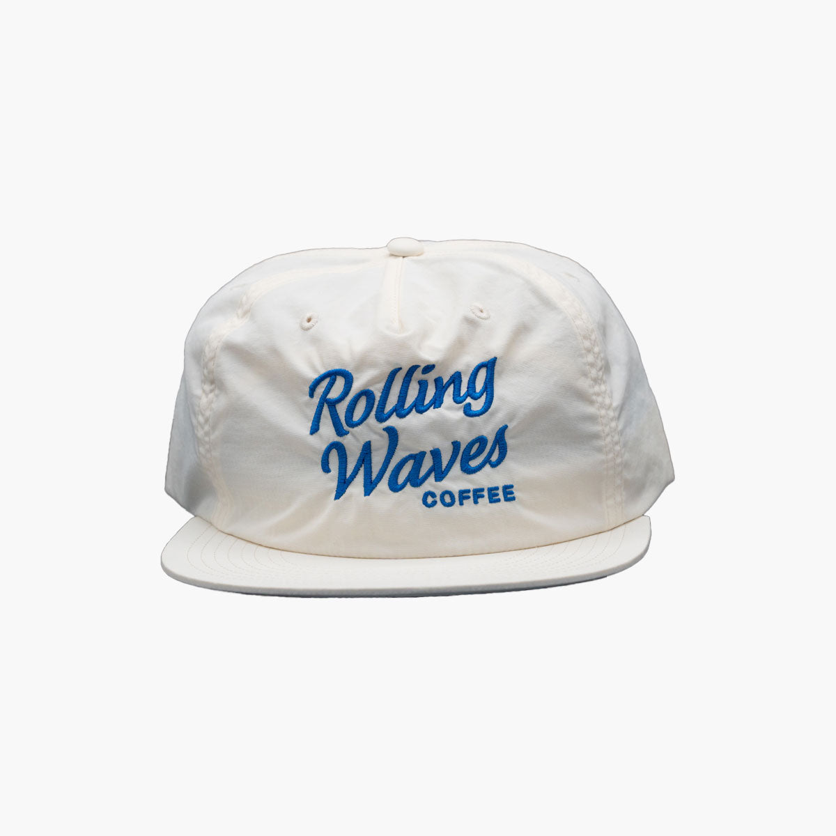 Front view of Rolling Waves OG Surf Cap in off-white with blue logo, recycled nylon unstructured snapback hat with UPF 50+ protection