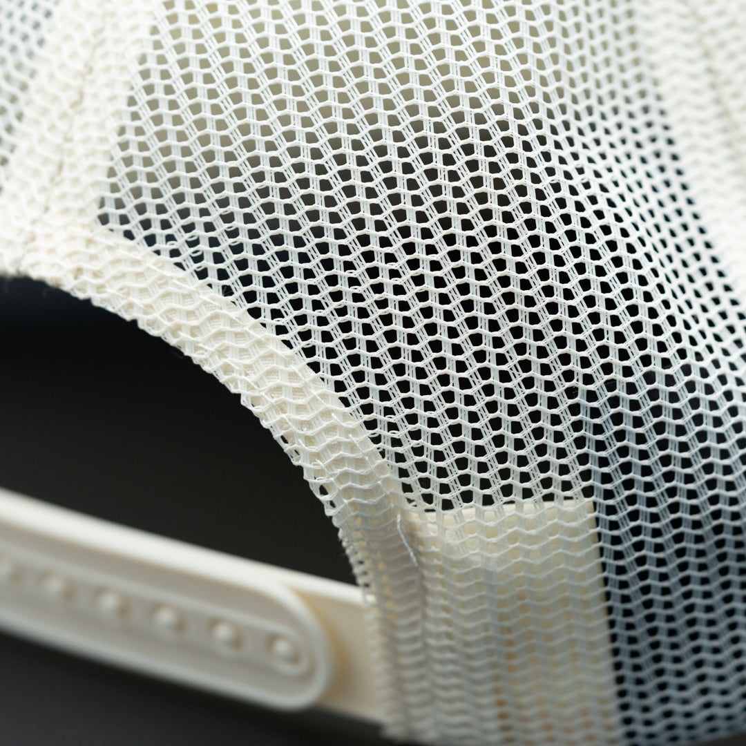 Adjustable enclosure of Rolling Waves West Coast Snapback in off-white with blue logo, high-profile foam snapback with recycled mesh back