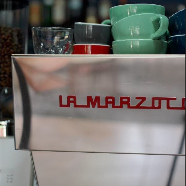 La Marzocco espresso machine with stacked Acme cups